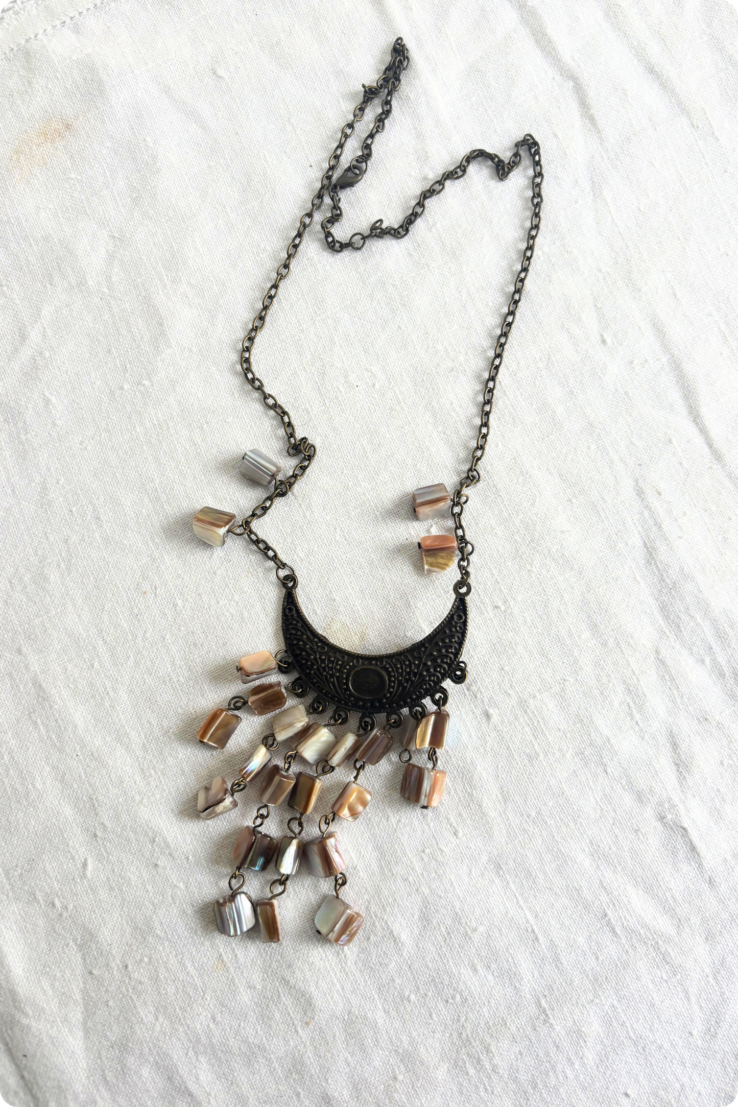 Bronzy half moon shell necklace