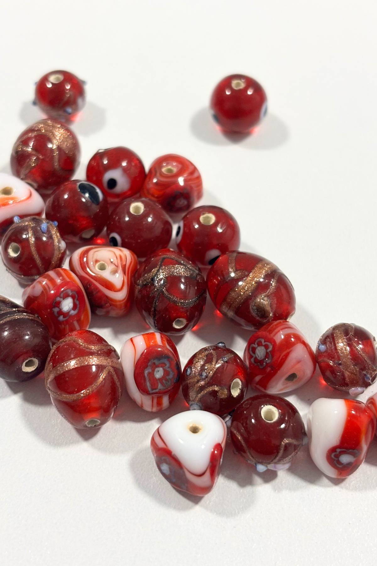 Assorted red Italian glass beads
