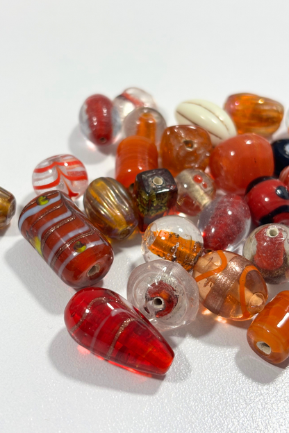 Beautiful, assorted orange glass beads