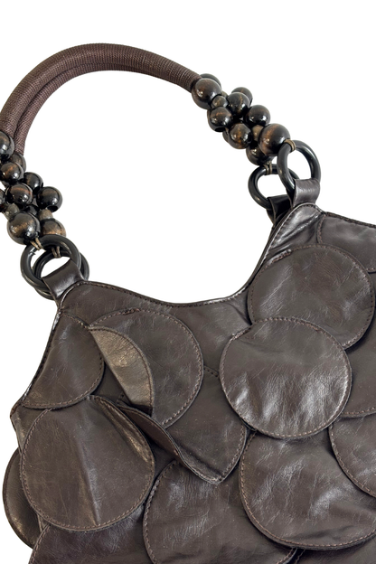 Circle patches beaded handle bag