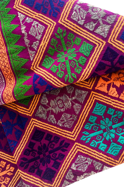 Vibrant colourful embroidered fabric
