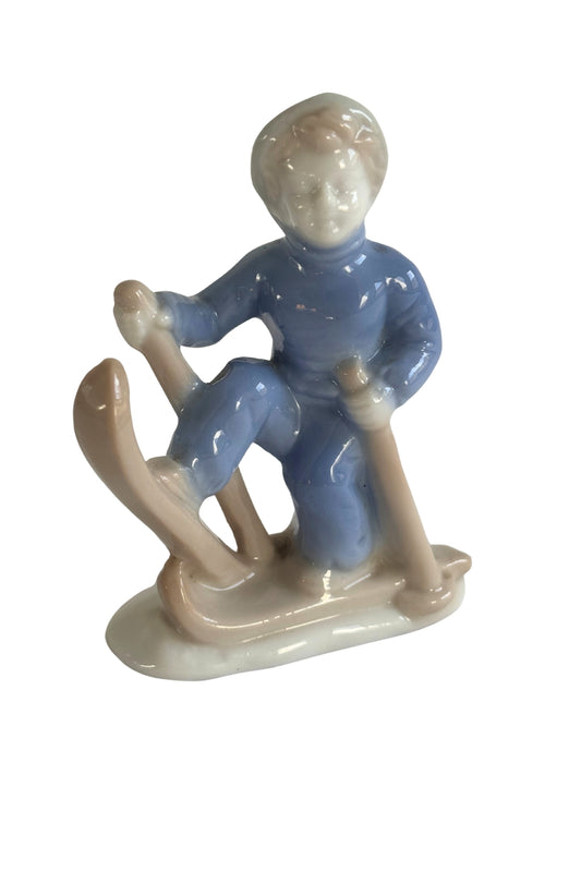 Vintage skier boy figurine