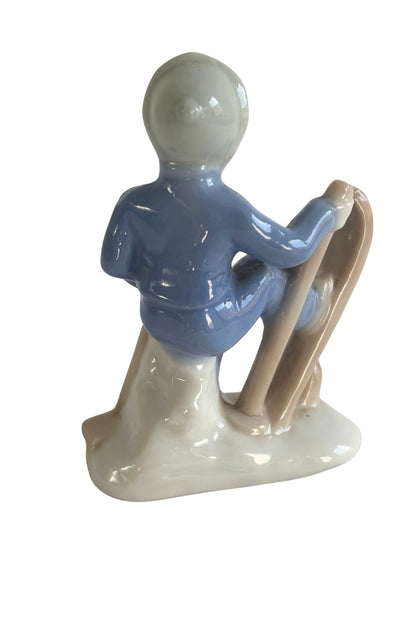 Vintage skier boy figurine